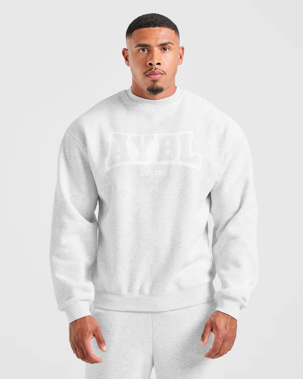 Cozy up in the Academy Oversized Sweater Grey Marl, featuring a relaxed fit and soft fabric for effortless everyday style.